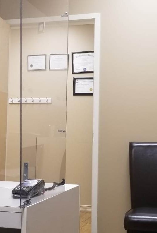 The reception desk, the doorway and a waiting chair at the Kingsway office